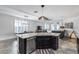 Open-concept kitchen with stainless steel appliances, granite countertops, an island, and access to living spaces at 7844 W Molly Dr, Peoria, AZ 85383