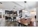 Spacious kitchen featuring a center island with a breakfast bar, modern appliances and stylish lighting at 7844 W Molly Dr, Peoria, AZ 85383