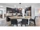 Stylish kitchen featuring granite countertops, stainless steel appliances, and a spacious center island with seating at 7844 W Molly Dr, Peoria, AZ 85383