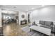 Open-concept living space with seamless flow to the kitchen and dining area, featuring stylish furniture at 7844 W Molly Dr, Peoria, AZ 85383