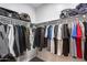 Spacious walk-in closet with clothing racks, shelves, and organized storage solutions at 7844 W Molly Dr, Peoria, AZ 85383