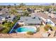 Home aerial featuring a private pool, fenced yard, and lush surrounding greenery at 8613 E Citrus Way, Scottsdale, AZ 85250