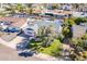 Aerial view of the house, lush front lawn, mature tree, and a long driveway showcasing curb appeal at 8613 E Citrus Way, Scottsdale, AZ 85250