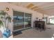Covered back patio area featuring a bar area, with views of the pool for outdoor entertaining at 8613 E Citrus Way, Scottsdale, AZ 85250