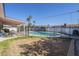 Fenced pool, covered patio with seating, and a well-maintained backyard offering a private and relaxing outdoor space at 8613 E Citrus Way, Scottsdale, AZ 85250