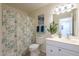 Fresh bathroom with modern vanity, decorative plant and soothing color palette at 8613 E Citrus Way, Scottsdale, AZ 85250