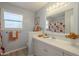 Charming bathroom featuring bright tile countertops, matching cabinetry, and a floral-themed shower curtain at 8613 E Citrus Way, Scottsdale, AZ 85250