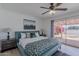 Comfortable bedroom features a sliding glass door to the backyard, allowing for plenty of natural light and easy access at 8613 E Citrus Way, Scottsdale, AZ 85250