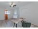 Bright bedroom with modern desk, ceiling fan, and double door closet space at 8613 E Citrus Way, Scottsdale, AZ 85250
