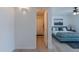 Bright bedroom featuring a stylish bed, ceiling fan, and a bathroom with shower in this well-lit space at 8613 E Citrus Way, Scottsdale, AZ 85250