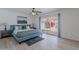 Comfortable bedroom features a sliding glass door to the backyard, allowing for plenty of natural light and easy access at 8613 E Citrus Way, Scottsdale, AZ 85250