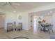 Open-concept layout of a dining area featuring seating for four, stylish decor, and modern light fixtures at 8613 E Citrus Way, Scottsdale, AZ 85250