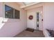 Inviting front entrance with a classic white door, decorative wreath and stylish address numbers at 8613 E Citrus Way, Scottsdale, AZ 85250