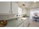 Clean kitchen showcasing countertops, sink, and a view to the dining area, perfect for easy meal preparation at 8613 E Citrus Way, Scottsdale, AZ 85250