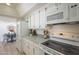 Bright kitchen features white appliances and a view into the dining area, creating a functional and stylish space at 8613 E Citrus Way, Scottsdale, AZ 85250