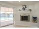 Close-up view of the living room's fireplace and sliding door, highlighting the seamless indoor-outdoor connection at 8613 E Citrus Way, Scottsdale, AZ 85250