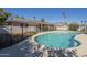 Inviting pool area, perfect for relaxation, surrounded by a secure fence and a well-maintained backyard at 8613 E Citrus Way, Scottsdale, AZ 85250