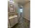 This bathroom includes updated flooring and a single sink vanity at 9068 E Chambers St, Mesa, AZ 85208