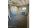 This bedroom includes a built-in vanity, and an adjacent bathroom and closet at 9068 E Chambers St, Mesa, AZ 85208