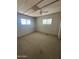 Comfortable bedroom with neutral carpet, bright windows, and closet at 9068 E Chambers St, Mesa, AZ 85208