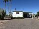 Single-story home with covered parking, desert landscaping, and private back patio at 9068 E Chambers St, Mesa, AZ 85208