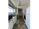 Functional kitchen with a refrigerator, sink, microwave, and laundry machines at 9068 E Chambers St, Mesa, AZ 85208