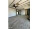 Large living room featuring neutral carpet, ceiling fan, and access to other rooms at 9068 E Chambers St, Mesa, AZ 85208