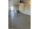 A spacious living room features neutral paint, ceiling fans, and sliding glass doors for lots of natural light at 9068 E Chambers St, Mesa, AZ 85208