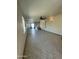 A spacious living room features neutral paint, ceiling fans, and sliding glass doors for lots of natural light at 9068 E Chambers St, Mesa, AZ 85208