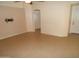 An empty living room features tile flooring and neutral walls, offering ample space for furnishings and decor at 10302 E Cicero Cir, Mesa, AZ 85207
