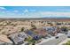 An aerial view features the roof, surrounding homes and desert environment at 10841 W Nosean Rd, Peoria, AZ 85383