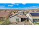 Aerial view of the backyard featuring desert landscaping, an entertainment area, and a private setting with mountain views at 10841 W Nosean Rd, Peoria, AZ 85383