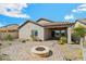 A great backyard has a patio, firepit, and professional desert landscaping at 10841 W Nosean Rd, Peoria, AZ 85383