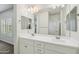 Bathroom featuring double sinks, modern fixtures, ample counter space, and a window at 10841 W Nosean Rd, Peoria, AZ 85383