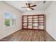 This bedroom shows a large bookcase and wood laminate flooring at 10841 W Nosean Rd, Peoria, AZ 85383