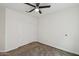 This bedroom offers practical storage with a closet and neutral carpeting for comfort at 10841 W Nosean Rd, Peoria, AZ 85383