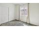 Bedroom features neutral carpet, a window with curtains, and a closet at 10841 W Nosean Rd, Peoria, AZ 85383