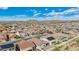 Aerial view of a bustling neighborhood with diverse housing styles, offering a glimpse into community living with mountain views at 10841 W Nosean Rd, Peoria, AZ 85383