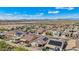 Overview of a vibrant community featuring houses with solar panels, set against a backdrop of mountains and desert at 10841 W Nosean Rd, Peoria, AZ 85383