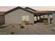 A single-story home with desert landscaping, a tile roof, and a covered patio at 10841 W Nosean Rd, Peoria, AZ 85383