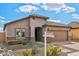 Charming single-story home featuring desert landscaping, tile roof, and paved driveway at 10841 W Nosean Rd, Peoria, AZ 85383