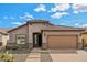 Charming single-story home with a tile roof, desert landscaping, and a spacious two-car garage at 10841 W Nosean Rd, Peoria, AZ 85383