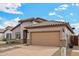 Charming single-story home featuring a well-manicured front yard and a two-car garage at 10841 W Nosean Rd, Peoria, AZ 85383