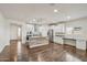 Bright kitchen with white cabinets, stainless steel appliances, an island with a wood accent, and a connected workspace at 10841 W Nosean Rd, Peoria, AZ 85383