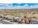 Scenic street view featuring desert landscape and residential homes against a clear blue sky with scattered clouds at 10841 W Nosean Rd, Peoria, AZ 85383