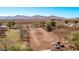 Expansive rural property showcasing a large dirt lot with beautiful mountain views in the background at 11124 W Southern Ave, Tolleson, AZ 85353