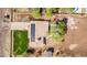 Aerial view showcases a single-Gathering home with a well-manicured lawn and solar panels under a blue sky at 11124 W Southern Ave, Tolleson, AZ 85353