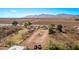 Expansive rural property showcasing a large dirt lot with beautiful mountain views in the background at 11124 W Southern Ave, Tolleson, AZ 85353