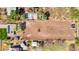 Drone perspective shows a vacant lot, surrounded by homes and farm land, under a bright blue sky at 11124 W Southern Ave, Tolleson, AZ 85353