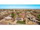 Neighborhood aerial view showcases multiple single-Gathering homes with mature trees and well-maintained yards under a blue sky at 11124 W Southern Ave, Tolleson, AZ 85353